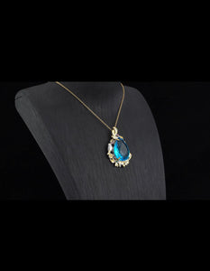 Swiss Blue Topaz Pendant Necklace - Simulated purple and green Diamond in dualtone goldtone and Stainless Steel